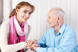 caregiver talking to and elder